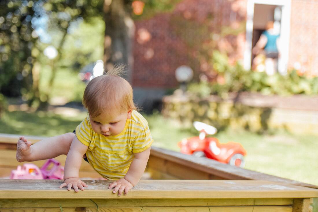 toddler climbing out of crib
